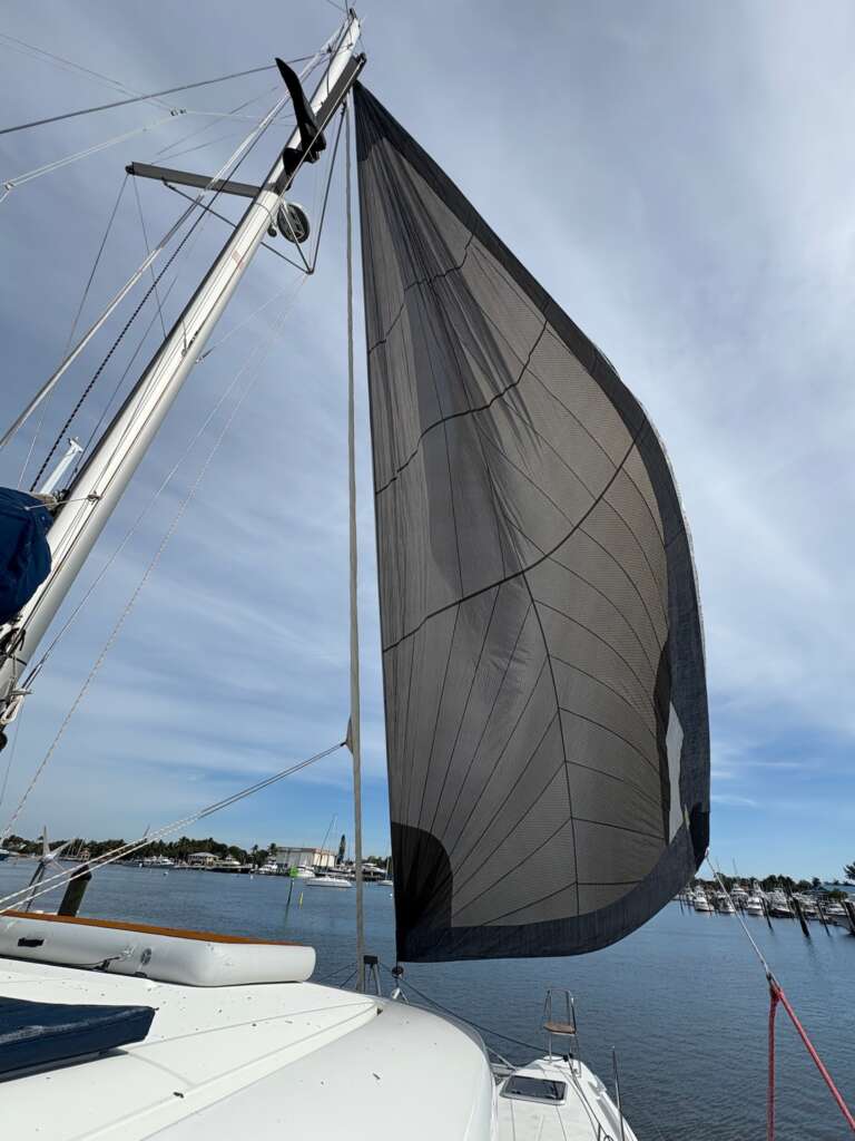 Looking up at the raised sail from Luna Cat’s deck